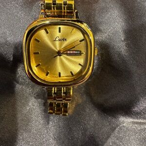 Gold Lsvtr Watch with Date Display